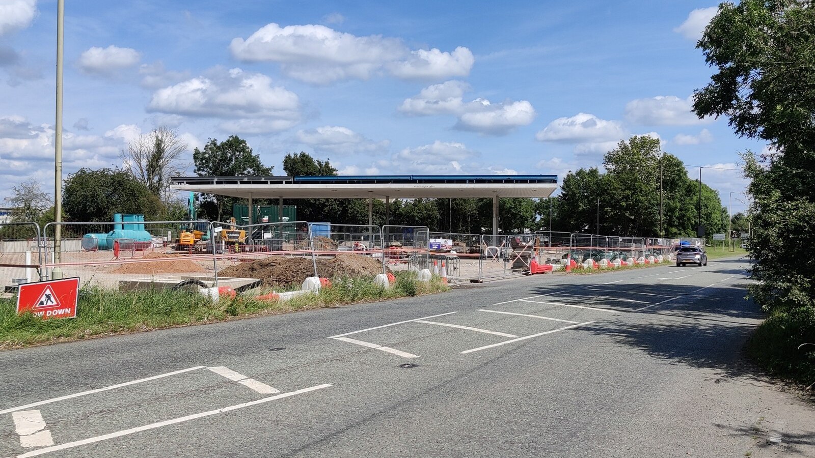Petrol station under construction with canopy and unfinished forecourt