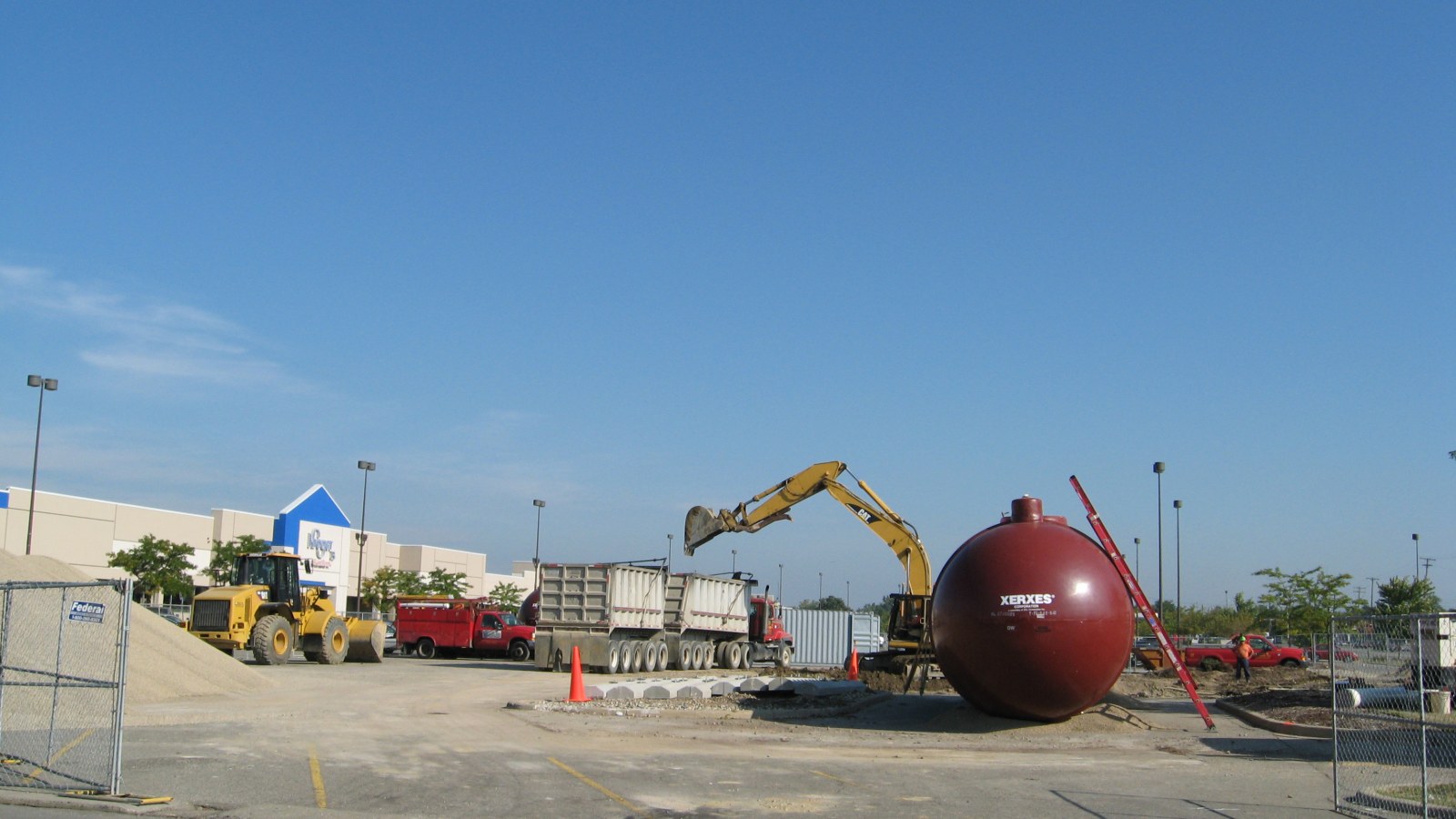 Underground fuel storage tank positioned at a service station construction site