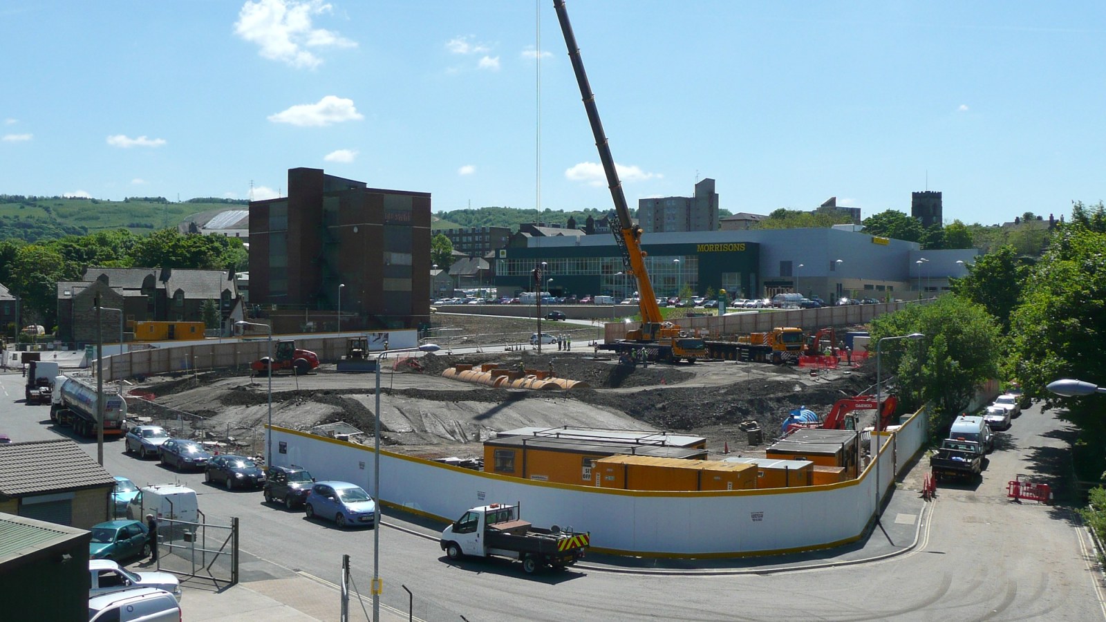 Petrol station construction site with a crane and extensive ground works