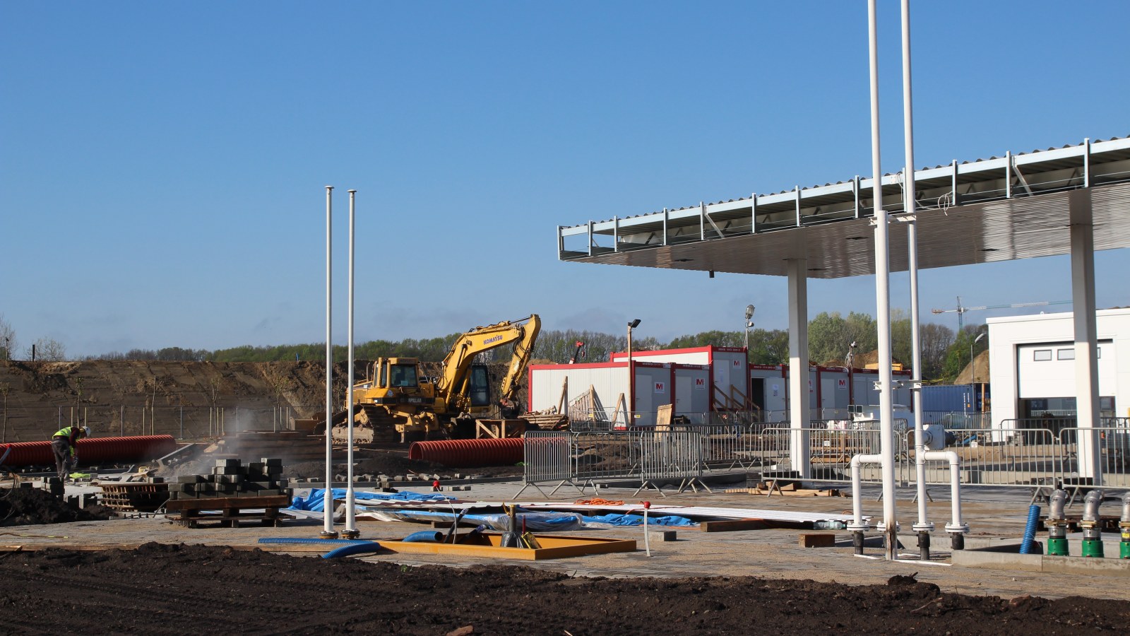 Excavators carrying out earthworks at a petrol station construction site