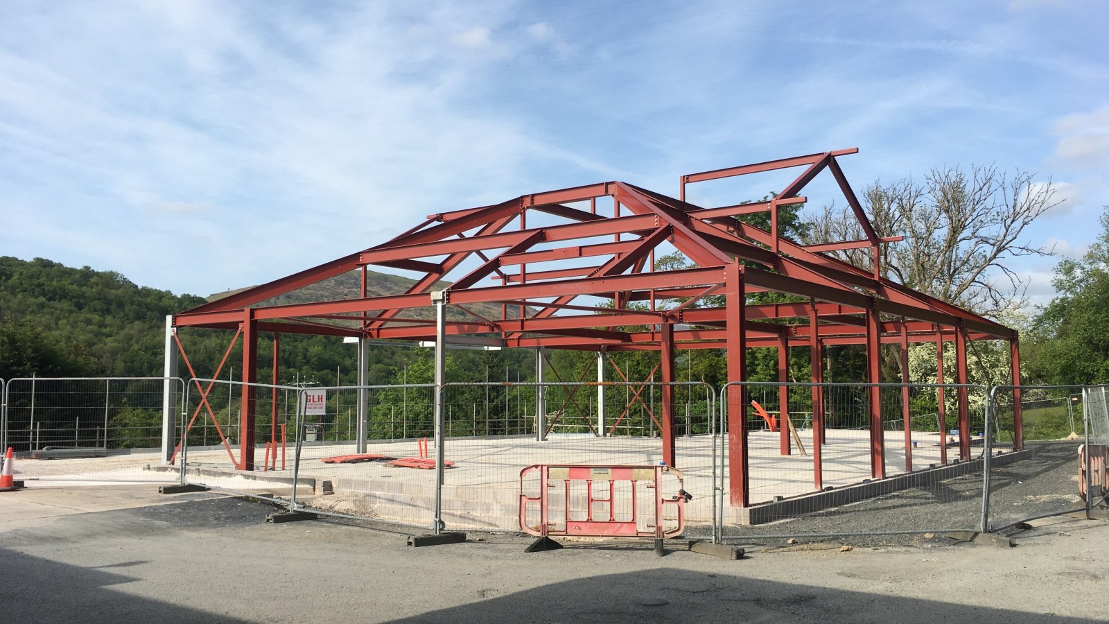 Steel-framed service station building under construction